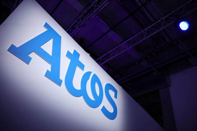 Atos lifts sales target, expands divestment plan